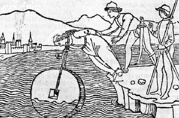 Original caption: Drowning a woman with a millstone around her neck. 1554 --- Image by © Corbis
